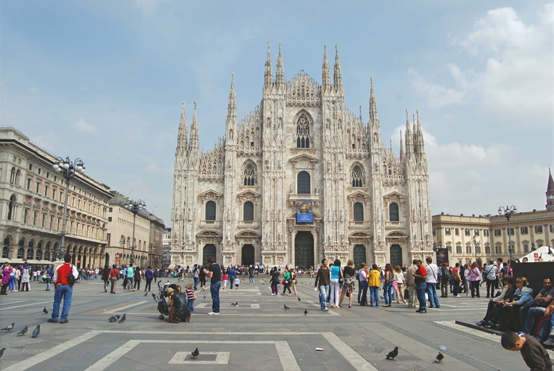 24 - The magnificent Milan Cathedral (Duomo di Milano) set against a bustling Piazza del Duomo in Milan